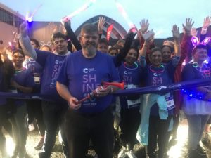 Cancer survivor Ian Anderson sounds the horn at the start of Shine Glasgow a 10K night time walk through Glasgow scaled