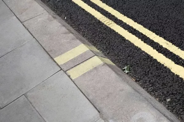 Legs Walking Across Road Surface