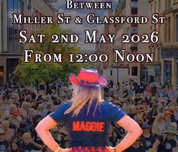 A woman in a red hat and tartan skirt, with “Maggie” on her shirt, stands facing a large crowd on a city street. Event details above read: Argyle St, Glasgow, Sat 2nd May 2026, from 12:00 midday.