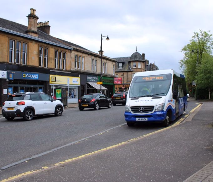 Shops and a bus stop on Drymen Road in Bearsden