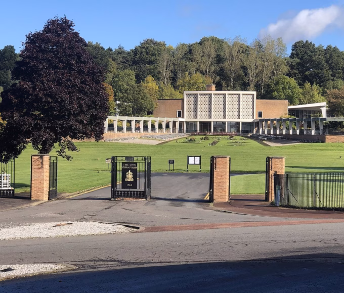 Linn Crematorium in Glasgow, seen past its gates and lawns
