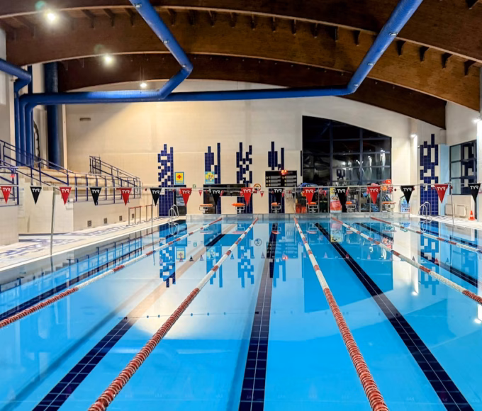 An indoor swimming pool with lane ropes