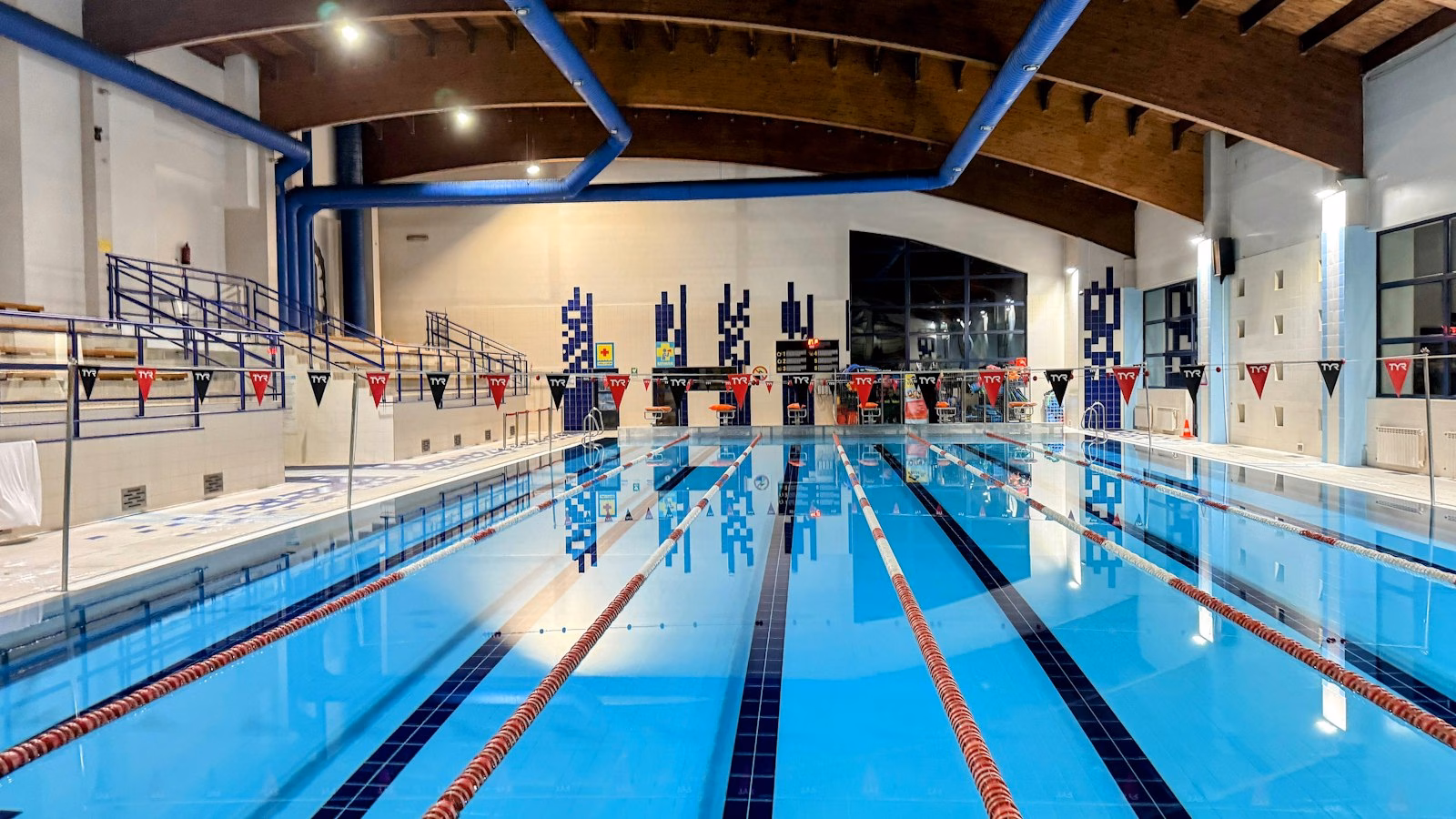 An indoor swimming pool with lane ropes